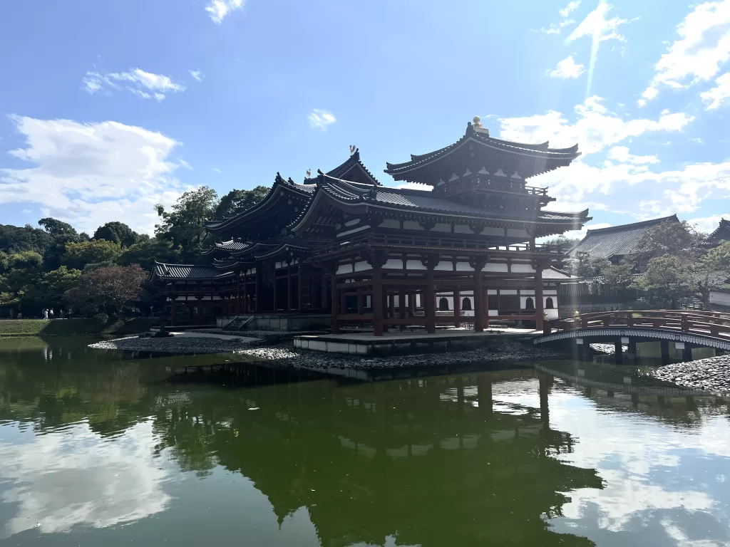 A Japanese temple on an emerald water in Uji, Kyoto
