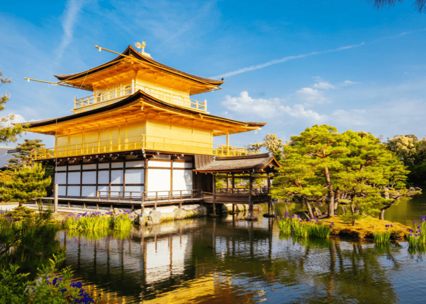 a Golden Pavilion standing on transparent water surrounded by trees, located in one of the most expensive areas in kyoto